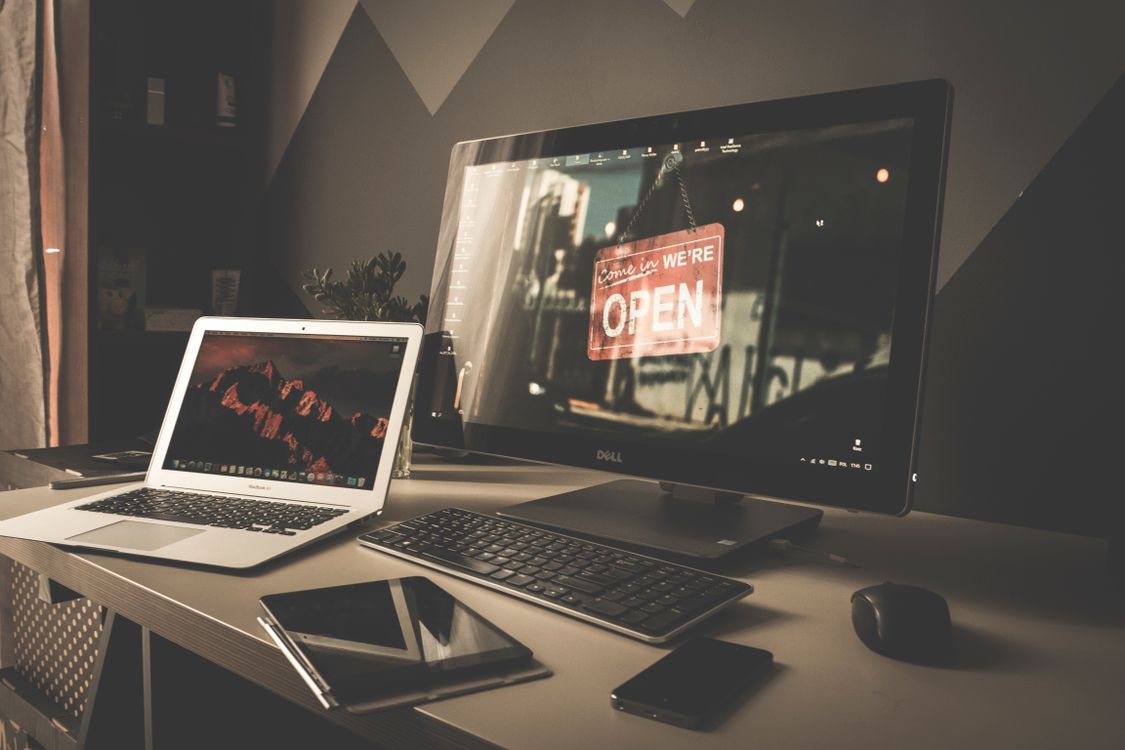 Modern workspace with laptop and external monitor setup for productive remote work