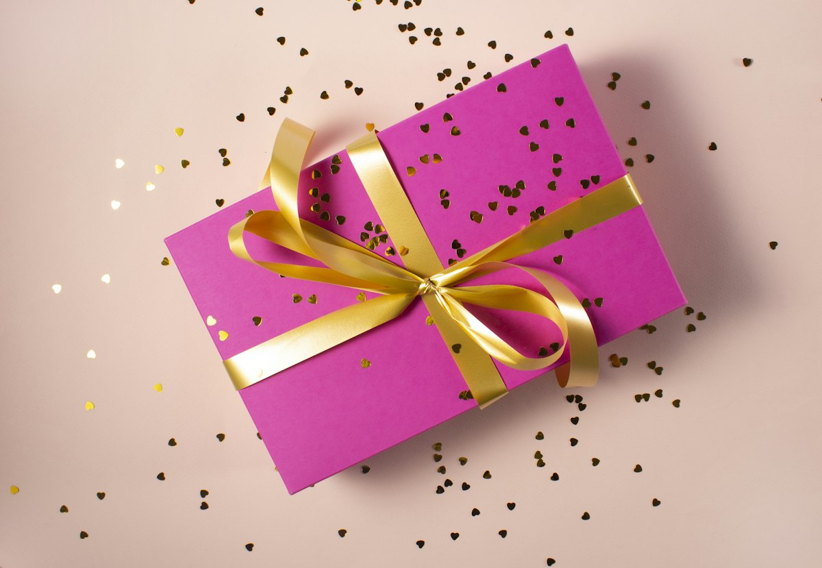 Elegant gift box with ribbon on a neutral background