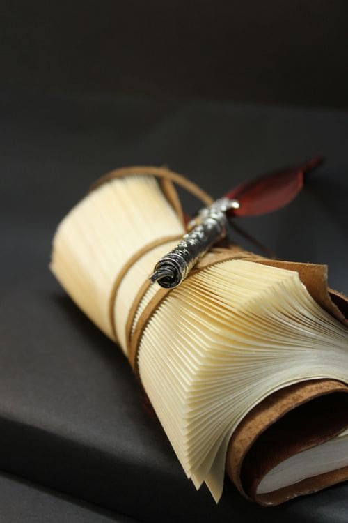 Premium fountain pen on a leather-bound diary, styled as a considered gift