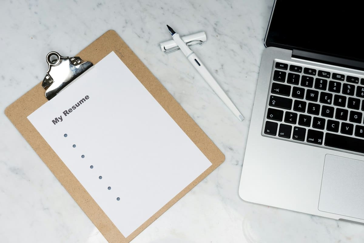 Desk organizer holding pens, scissors and stationery items in natural light
