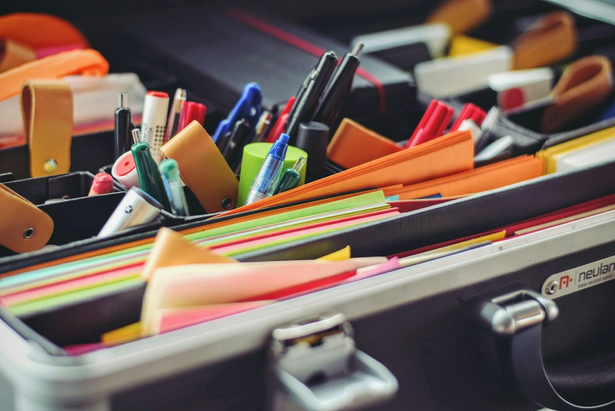 Stationery flat-lay with pens and paper supplies