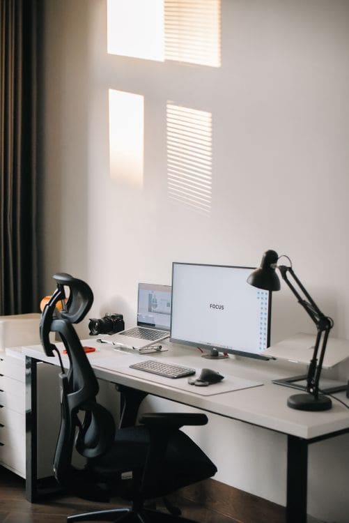 Clean and organized home office with an ergonomic desk setup and comfortable chair